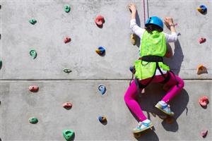 Climber on indoor rock-climbing wall